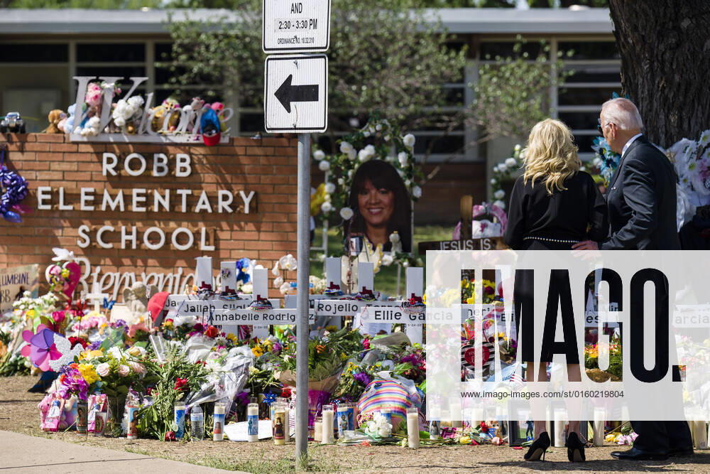 U.S. president Joe Biden and First Lady Jill Biden visit and lay a flower bouquet at a cross memorial in front of Robb Elementary School, in Uvalde, Texas, Sunday, May 29, 2022, the site of a mass shooting in which 18-year-old gunman Salvador Ramos massacred 19 children students and two adult teachers Tuesday, May 24, 2022. - ZUMAh163 20220529_znp_h163_012