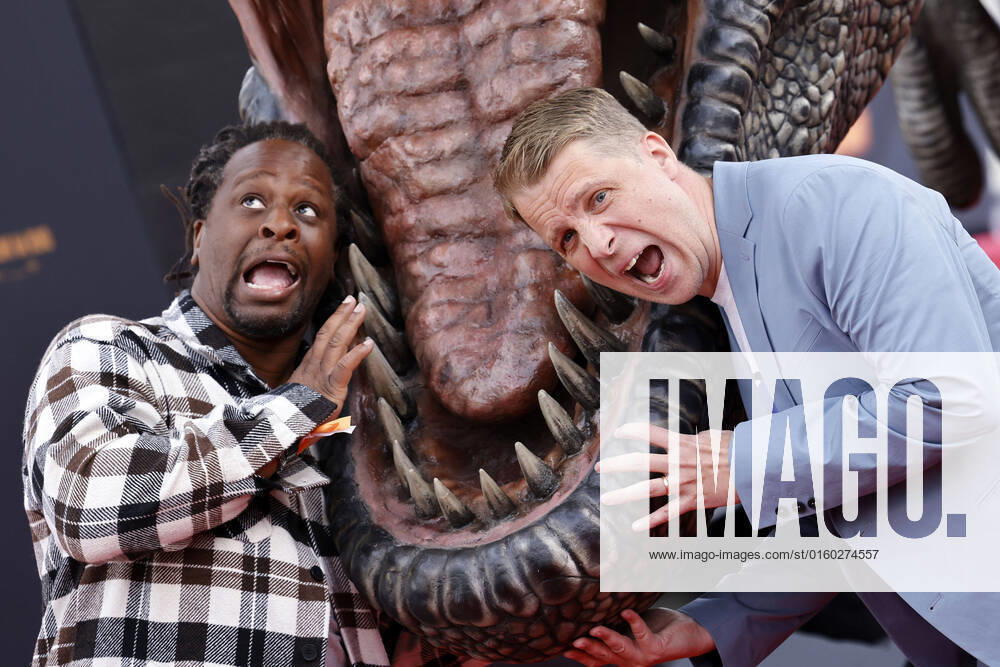 Presenter Mola Adebisi and entertainer Oliver Pocher in front of a T Rex at the German premiere of Jurassic World A New Age at the Cinedom cinema Cologne, 30 05 2022 NRW Germany