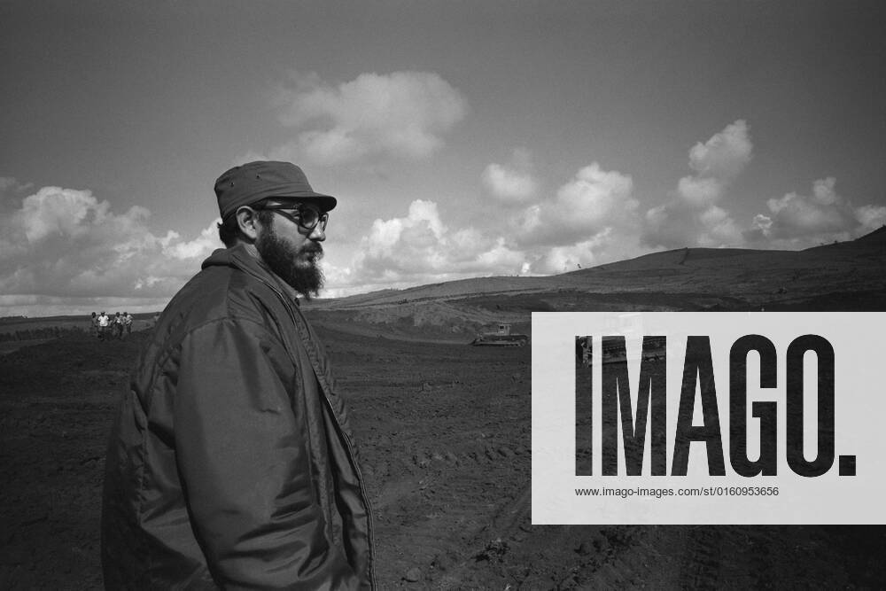 Fidel Castro standing on a field, half figure, half figure, he is watching two bulldozers at work, in 1967 in Cuba Fidel CASTRO actually Fidel Alejandro Castro Ruz , Cuba, politics, head of government of Cuba black and white, black and white, black and white, monochrome, SW monochrome, black and white photo,