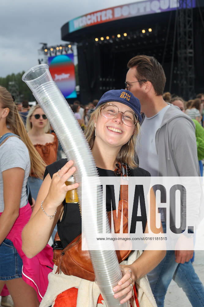 Illustration picture shows a festival goer with a pile of collected plastic cups at the one-day Werchter Boutique festival, in Werchter, on Friday 18 June 2021. VIRGINIExLEFOUR 36482085