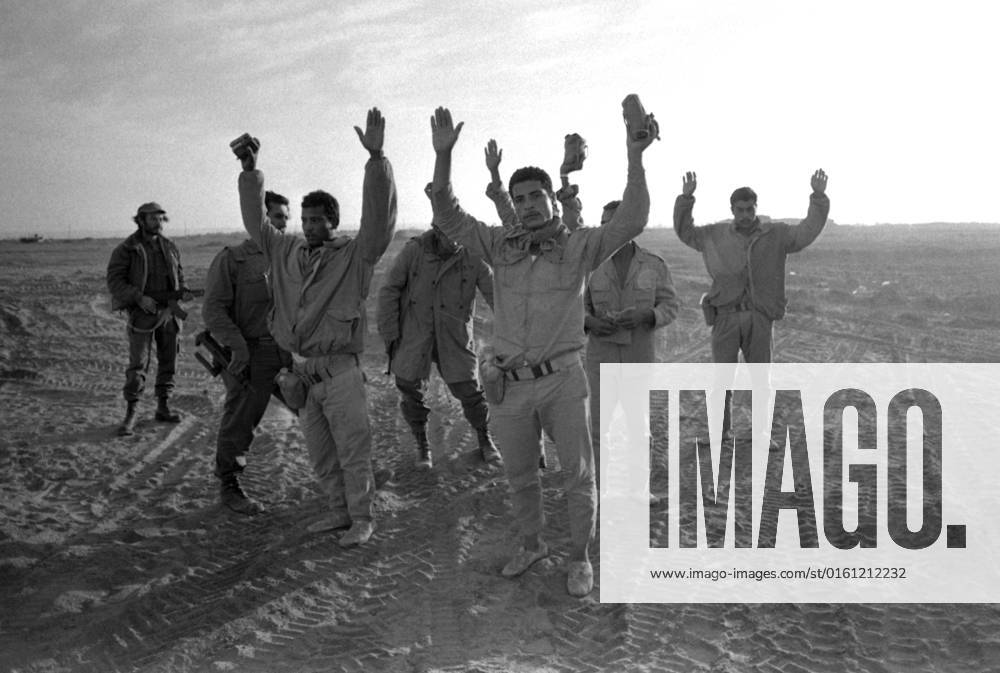 Egyptian soldiers standing in the sand with their hands raised, surrendered during the Yom Kippur War, the Yom Kippur War between Israel and the Arab states of Egypt, Jordan and Syria lasted from October 6 to October 25, 1973,