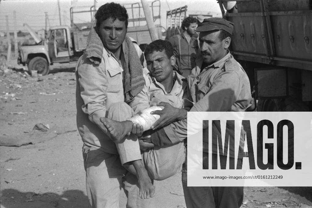 Egyptian soldiers carry an injured comrade discovered in a bunker during the Yom Kippur War, the Yom Kippur War between Israel and the Arab states of Egypt, Jordan and Syria lasted from October 6 to October 25, 1973,