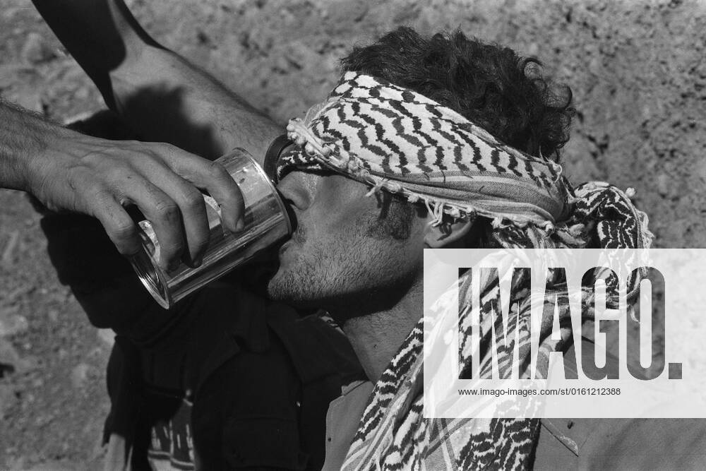 Syrian prisoner, soldier of the Syrian army, bound blindfolded, gets water to drink, during the Yom Kippur War, the Yom Kippur War between Israel and the Arab states of Egypt, Jordan and Syria lasted from October 6 to October 25, 1973,
