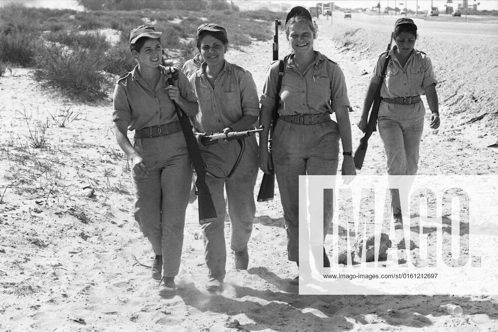 Israeli female soldiers marching with their rifles, during basic training, marching, during the Yom Kippur War, the Yom Kippur War between Israel and the Arab states of Egypt, Jordan and Syria lasted from October 6 to October 25, 1973,