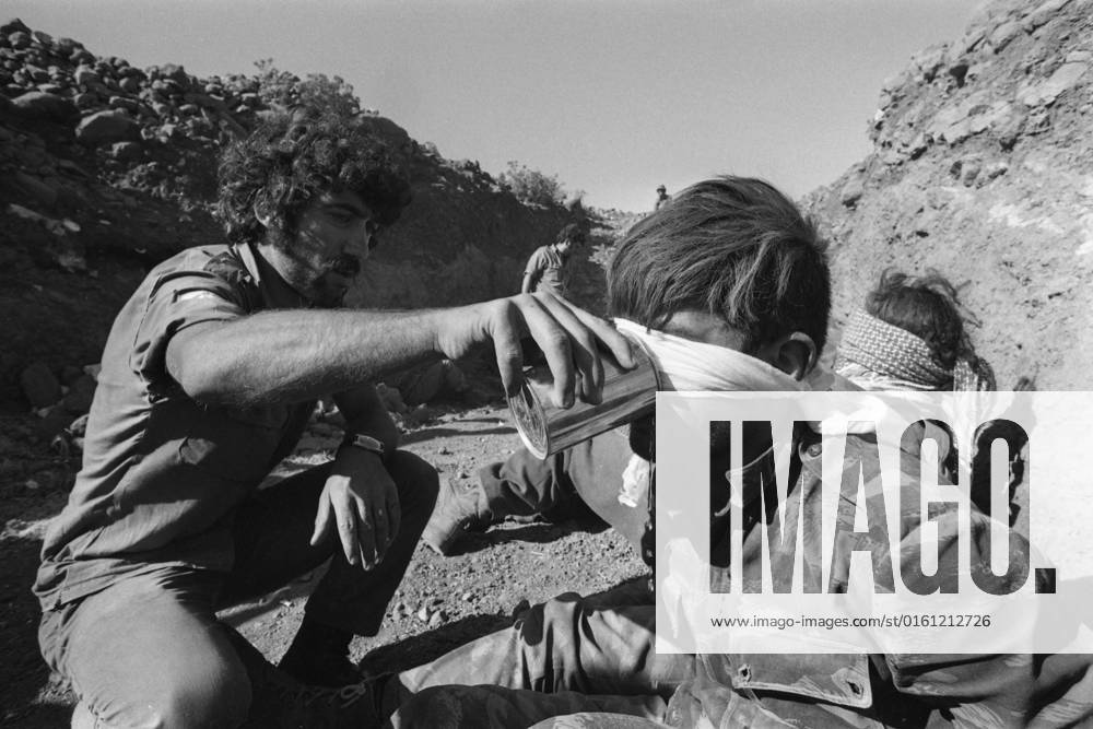 Syrian prisoners on the Golan Heights, get water to drink, during the Yom Kippur War, the Yom Kippur War between Israel and the Arab states of Egypt, Jordan and Syria lasted from October 6 to October 25, 1973,