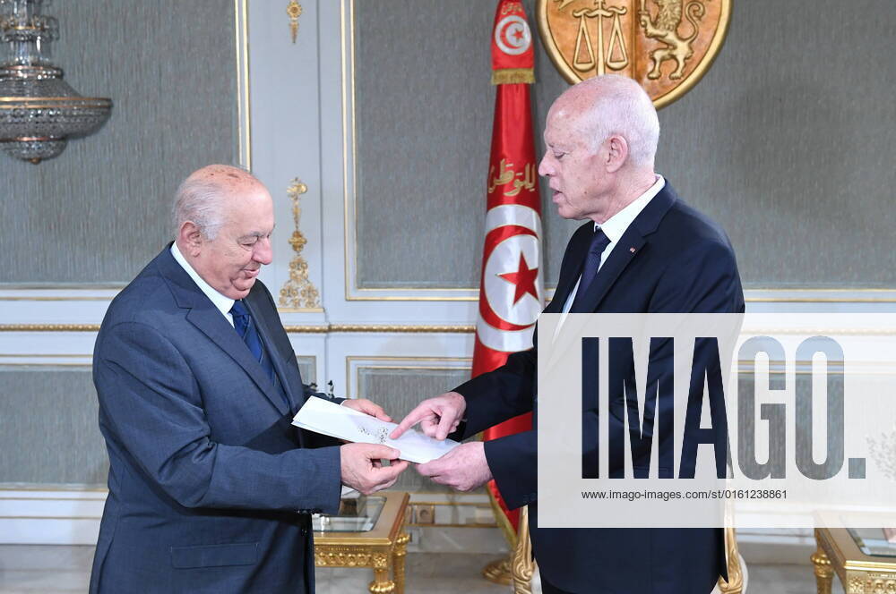 (220620) -- TUNIS, June 20, 2022 -- Tunisian President Kais Saied (R) receives the draft of a new constitution from Sadok Belaid, head and coordinator of the High National Advisory Committee for the New Republic, in Tunis, Tunisia, on June 20, 2022. Saied declared in December last year that a constitutional referendum will be held in 2022 for a new republic, and later set the voting date for July 25, the country s Republic Day. ( Handout via Xinhua) TUNISIA-TUNIS-DRAFT OF NEW CONSTITUTION TunisianxPresidency