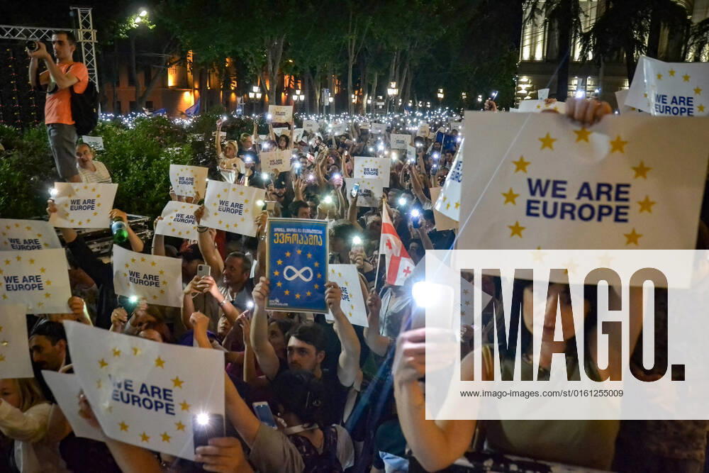 Pro EU protesters hold their smartphone with the flashlight on and placards written on them We Are Europe during the demonstration. After the decision of the European Commission who recommended that Georgia be denied EU (European Union) candidate status, thousands of people marched across the center of Tbilisi expressing their opinions while demanding to join the European Union. Tbilisi Georgia - ZUMAs197 20220620_zaa_s197_341