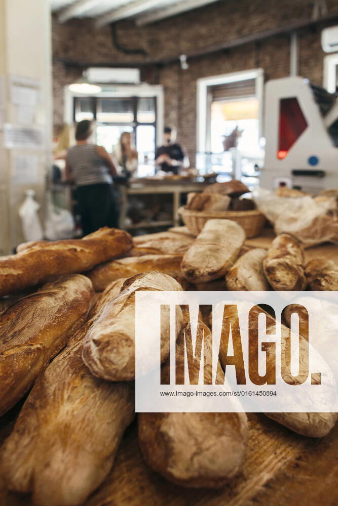 Baguettes arranged on table in bakery model released, Symbolfoto property released, JUBF00388