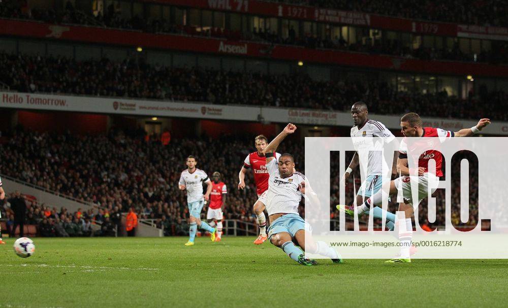 Arsenal s Lukas Podolski scoring his sides opening goal Arsenal vs West Ham United- Barclays Premier League - Emirates Stadium - London - England - 15 04 2014 - Pic David Klein Sportimage .