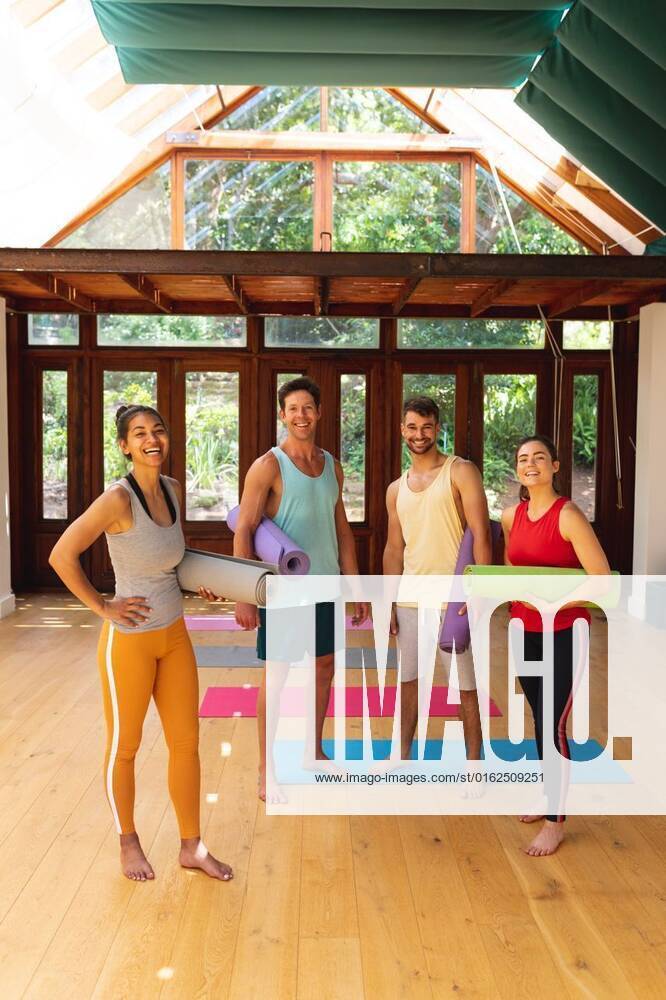 Portrait of happy multiracial male and female friends with exercise mats in yoga studio Portrait of happy multiracial male and female friends with exercise mats in yoga studio. healthy lifestyle and fitness., model released, , property released, Cape Town, South Africa, 30.10.2021, 3085649.jpg, people,portrait,happy multiracial,male female,friend,exercise mat,yoga studio,healthy lifestyle,fitness,exercise,workout,fit,athlete,training,young,sport,active,gym,adult,athletic,person,attractive,face,lifestyle,body,happy,pretty,smile,cute,multiracial,male,female,mat,yoga,studio,healthy Young Adult,Woman,Female,Mixed-Race,Man,Male,Caucasian,Mid Adult