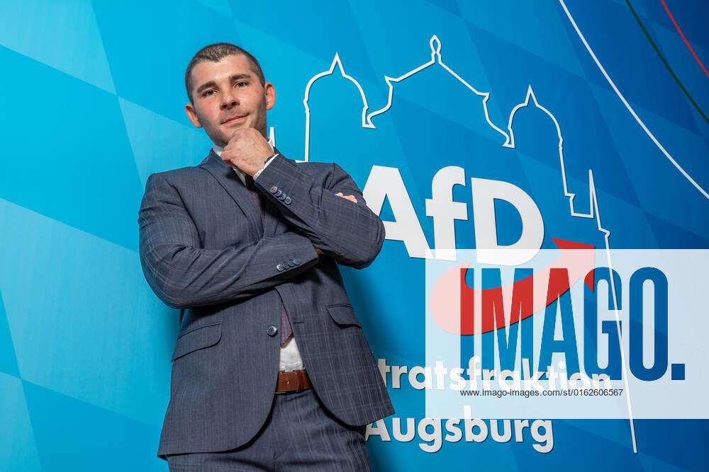 Augsburg, Bavaria, Germany - 06 September 2021: AfD Alternative for Germany politician Raimond Scheirich, deputy chairman of the Augsburg Stadt district association, in front of a poster reading: AfD Augsburg City Council faction
