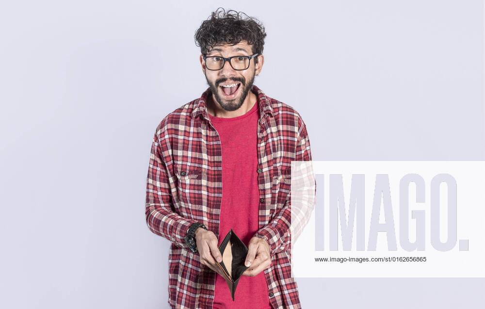 Unlucky and shocked Man View in a Empty Wallet, surprised Person sees its Empty Wallet, Youngster Man with Wallet without Money at white Background