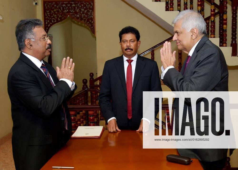 (220715) -- COLOMBO, July 15, 2022 -- Sri Lankan Prime Minister Ranil Wickremesinghe (R) is sworn in as interim president in Colombo, Sri Lanka, on July 15, 2022. Sri Lankan Prime Minister Ranil Wickremesinghe was sworn in as interim president before the chief justice on Friday, following the resignation of Gotabaya Rajapaksa, according to the prime minister s office. ( Handout via Xinhua) SRI LANKA-COLOMBO-INTERIM PRESIDENT-SWORN IN SrixLankanxPrimexMinister sxOffice