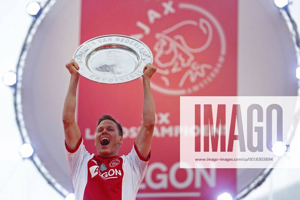 Niklas Moisander of Ajax celebrates with the Eredivisie Championship trophy celebrate winning the Dutch Eredivisie title at the Amsterdam Arena 2014 in Amsterdam, The Netherlands. Ajax crowned Eredivisie champions Dutch Eredividie 2013 2014 LaurensxLindhoutxIVx 2269070