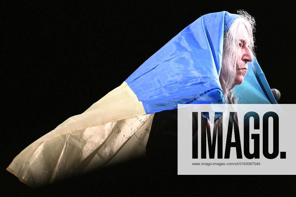 American singer and musician Patti Smith performs during her concert in Prague, Czech Republic, on July 19, 2022. On the photo Smith holds the Ukrainian flag. (CTKxPhoto MichalxKamaryt) CTKPhotoP2022071907998 kmt