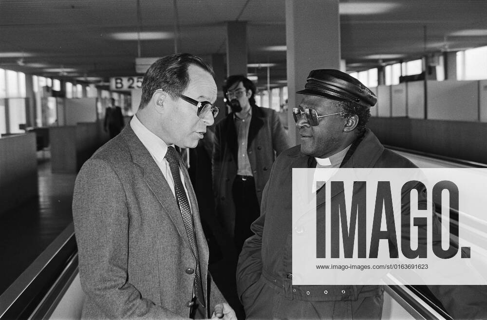 Anefo photo collection. Arrival SG South African Council of Churches, Desmond Tutu at Schiphol, after invitation Dutch Council of Churches, Desmond Tutu greeted by Dr. Fiolet. March 19, 1981