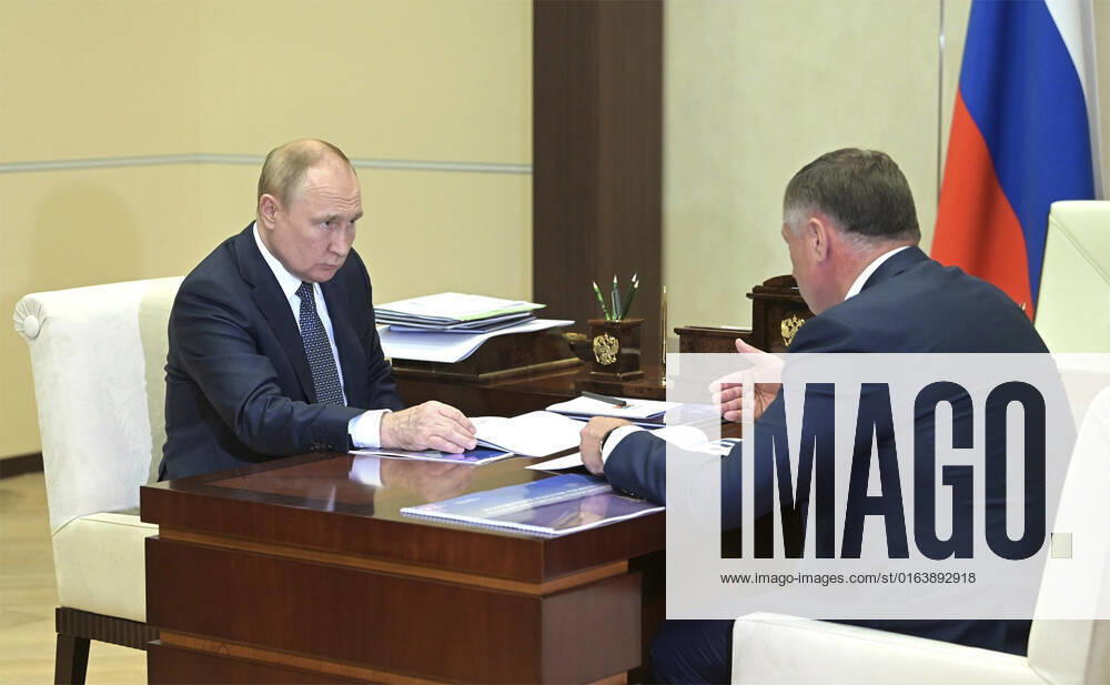 Russian President Vladimir Putin, left, holds a face-to-face meeting with Deputy Prime Minister Marat Khusnullin at the official presidential residence at Novo-Ogaryovo, July 29, 2022 outside Moscow, Russia. Khusnullin reported on the plans to rebuild Mariupol and other locations in the Lugansk and Donetsk regions captured in the Russian invasion of Ukraine. Moscow Russia - ZUMAp138 20220729_zaa_p138_003