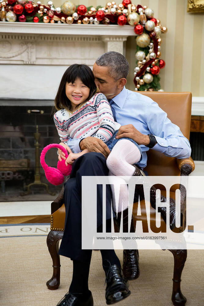 Dec. 4, 2015 The President snuggles with his niece Savita Ng after his sister, Maya Soetoro-Ng, and her family dropped by the Oval Office.
