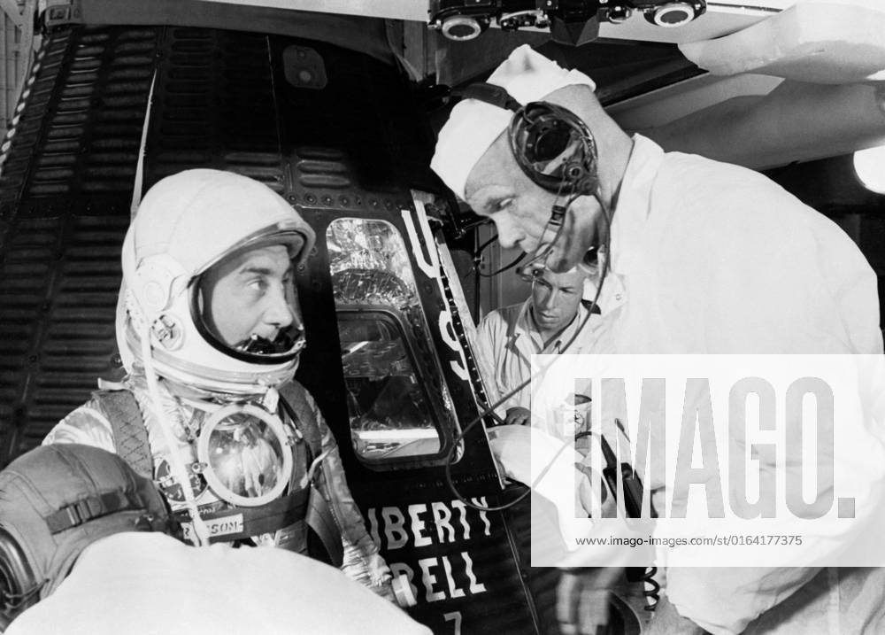 S61-02882 (1961) --- Astronaut Virgil I. (Gus) Grissom, suited up and ready to climb into Liberty Bell 7 spacecraft, talks with backup pilot John H. Glenn prior to insertion. The Mercury-Redstone 4 (MR-4) mission was scrubbed a few hours later due to unfavorable weather over the launch pad.