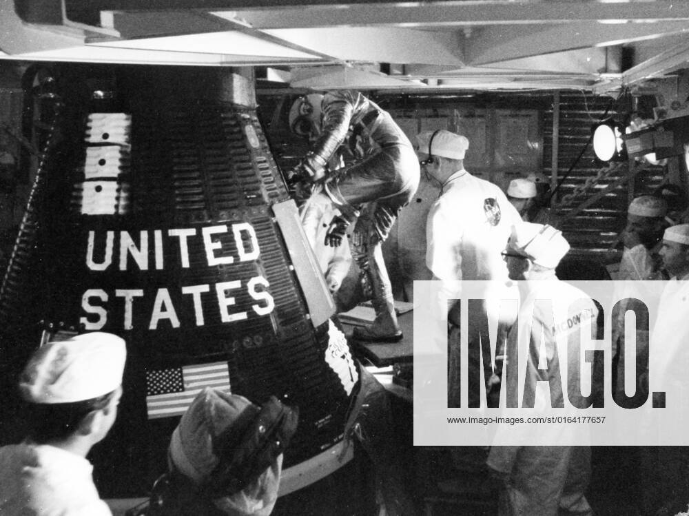 S63-06259 (14 May 1963) --- Astronaut L. Gordon Cooper Jr., prime pilot for the Mercury-Atlas 9 (MA-9) mission, is assisted into his Faith 7 Mercury spacecraft early morning on May 14, 1963. Cooper remained in the spacecraft for approximately five hours and then climbed out again as the mission was delayed because of trouble at a tracking station.