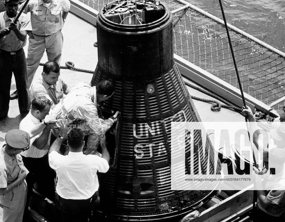 S63-07882 (16 May 1963) --- Astronaut L. Gordon Cooper Jr., pilot of the Mercury Atlas 9 (MA-9) mission, backs out of his spacecraft Faith 7 after a 600,000-mile, 22-orbit journey around Earth. He elected to remain in the spacecraft until it was hoisted to the deck of the USS Kearsarge, as did astronaut Walter Schirra during the previous mission.