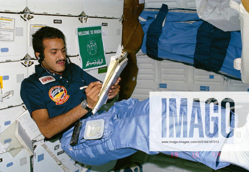 51G-04-010 (17 - 24 June 1985) --- Payload Specialist Sultan Salman Abdelize Al-Saud assumes a posture common to the weightlessness environment of space as he logs notes in Discovery?s middeck area.