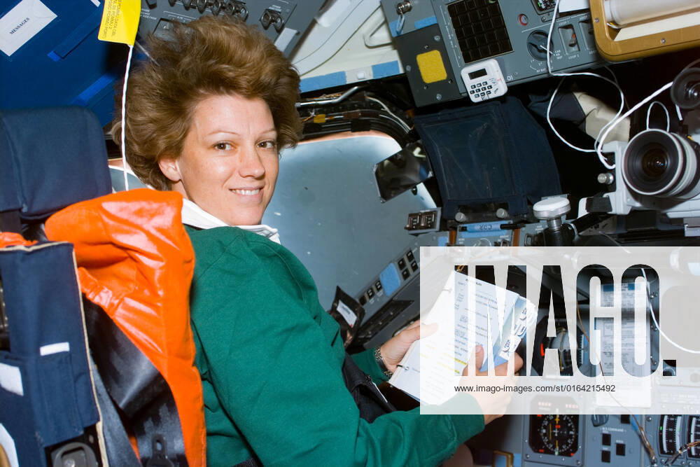 S93-E-5033 (23 July 1999) --- Astronaut Eileen M. Collins, mission commander, looks over a procedures checklist at the commander s station on the forward flight deck of the Space Shuttle Columbia on Flight Day 1. The most important event of this day was the deployment of the Chandra X-Ray Observatory, the world s most powerful X-Ray telescope. The photo was recorded with an electronic still camera (ESC).