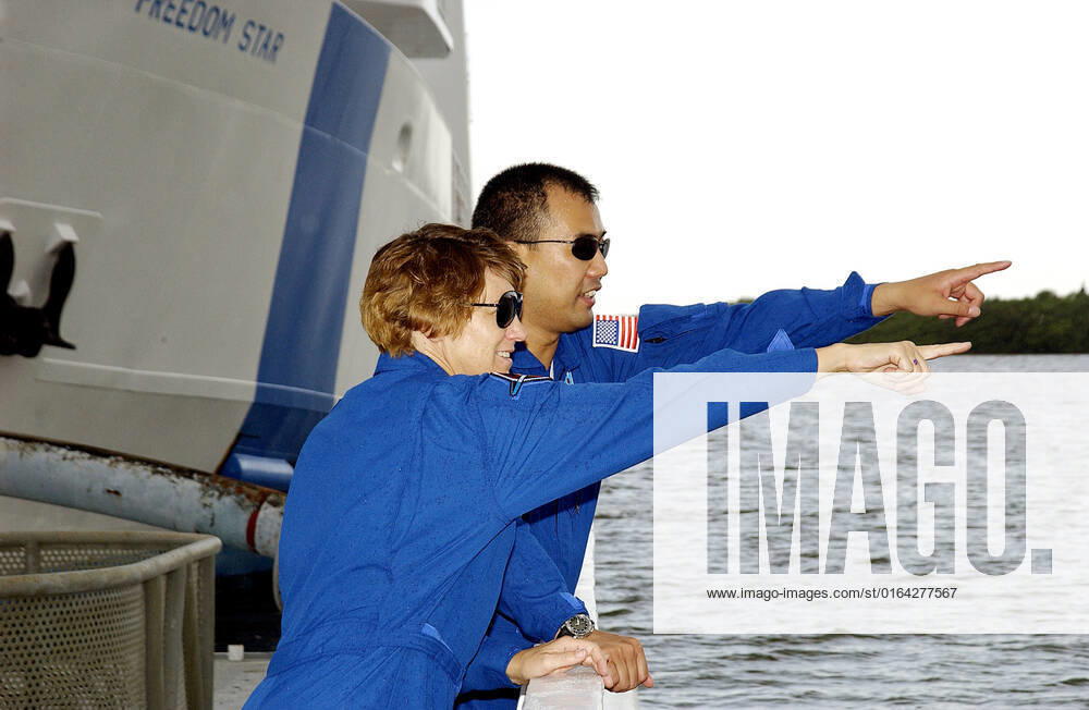 KENNEDY SPACE CENTER, FLA. - While touring the SRB Retrieval Ship Freedom Star, STS-114 Commander Eileen Collins and Mission Specialist Soichi Noguchi point at something on the Banana River. Noguchi is with the Japanese space agency NASDA. The ships routinely are docked at Hangar AF on the river. On their mission, the crew - which also includes Pilot James Kelly and Mission Specialist Stephen Robinson - will carry the MultiPurpose Logistics Module (MPLM) Raffaello and External Stowage Platform 2 to the International Space Station. The MPLM will contain supplies and equipment. Another goal of the mission is to remove and replace a Control Moment Gyro. Launch date for mission STS-114 is under review.
