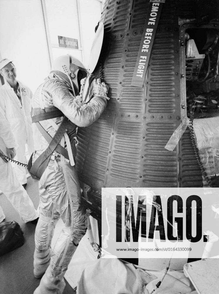 S61-02547 (5 May 1961) --- Astronaut Alan B. Shepard Jr., in his pressure suit and helmet, looks into the Freedom 7 capsule in preparation for ingress before the Mercury-Redstone 3 (MR-3) mission.