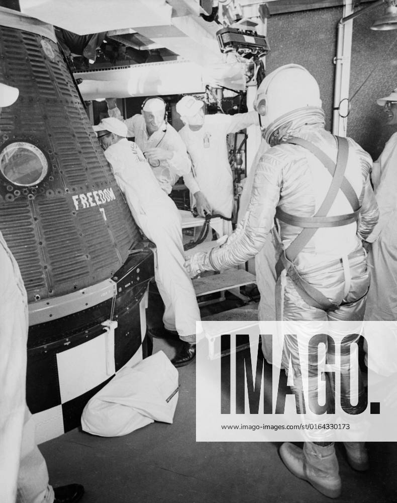 S61-02792 (5 May 1961) --- Astronaut Alan B. Shepard Jr., in his pressure suit and helmet, approaches the Freedom 7 capsule in preparation for insertion before the Mercury-Redstone 3 (MR-3) mission.