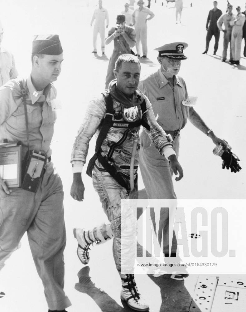 S61-02894 (21 July 1961) --- Astronaut Virgil I. (Gus) Grissom, pilot of the Mercury-Redstone 4 (MR-4) Liberty Bell 7 spaceflight, arrives aboard the recovery ship, USS Randolph, following his 15-minute, 37-second suborbital space mission. He is flanked by military medical officers.