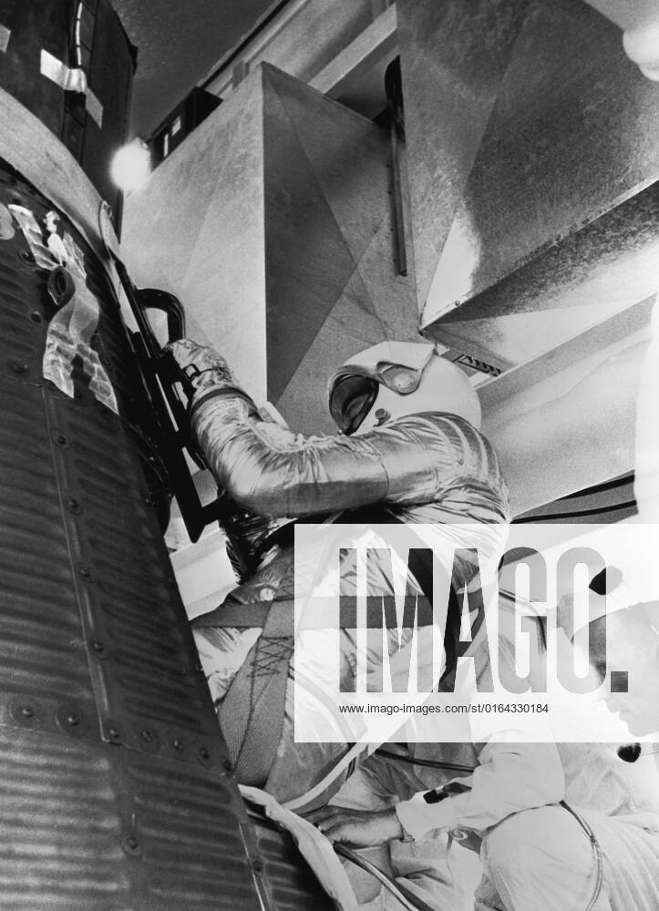 S61-03651 (5 May 1961) --- Astronaut Alan B. Shepard Jr., in his pressure suit and helmet, is being inserted into the Freedom 7 capsule in preparation for the Mercury-Redstone 3 (MR-3) mission.