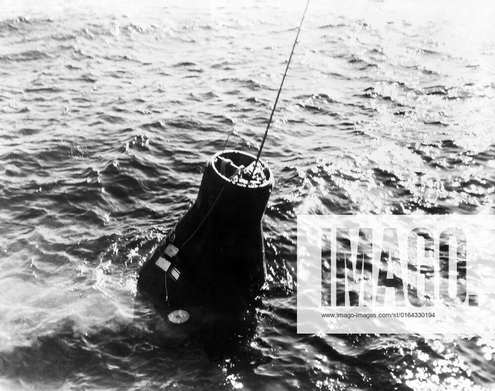 S62-00941 (20 Feb. 1962) --- The Mercury-Atlas 6 (MA-6) Friendship 7 spacecraft is retrieved from the Atlantic Ocean following astronaut John H. Glenn Jr. s three-orbit space mission. In this view, the capsule is still in the water, with retrieval cable connected to it.
