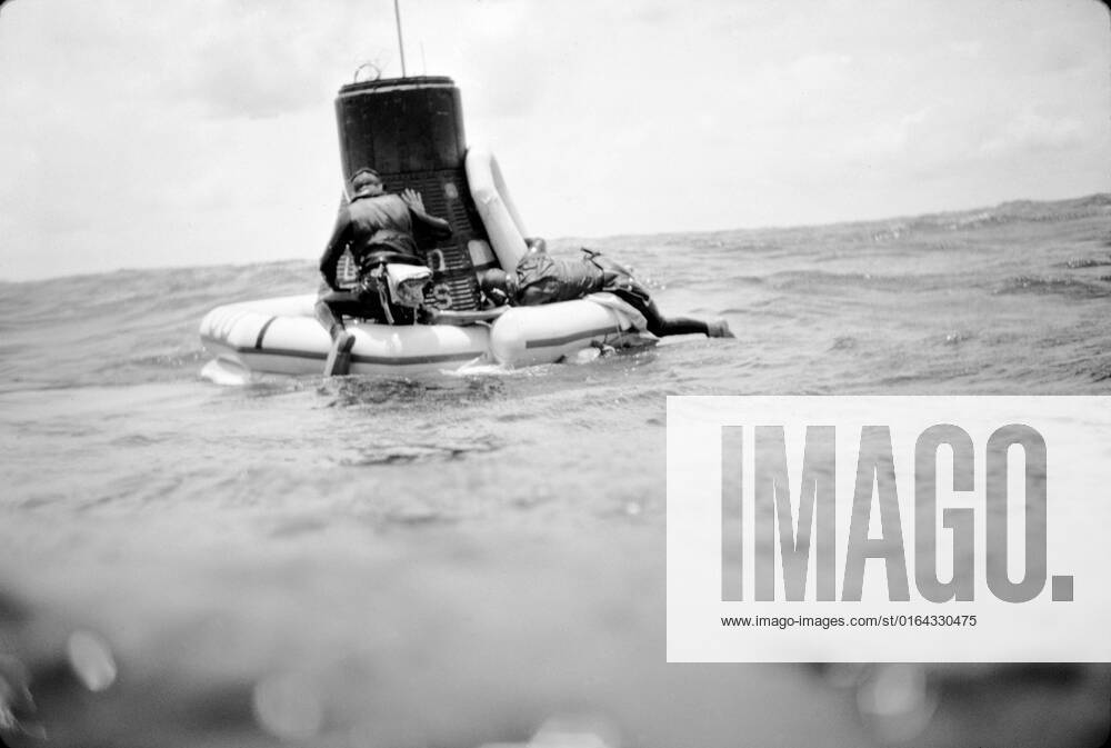 S63-07707 (16 May 1963) --- A U.S. Navy frogman team attaches a flotation collar to the Mercury-Atlas 9 (MA-9) Faith 7 spacecraft during recovery operations in the central Pacific near Midway Island. The Mercury-Atlas spacecraft with astronaut L. Gordon Cooper Jr., pilot, still inside, was hoisted aboard the USS Kearnage.