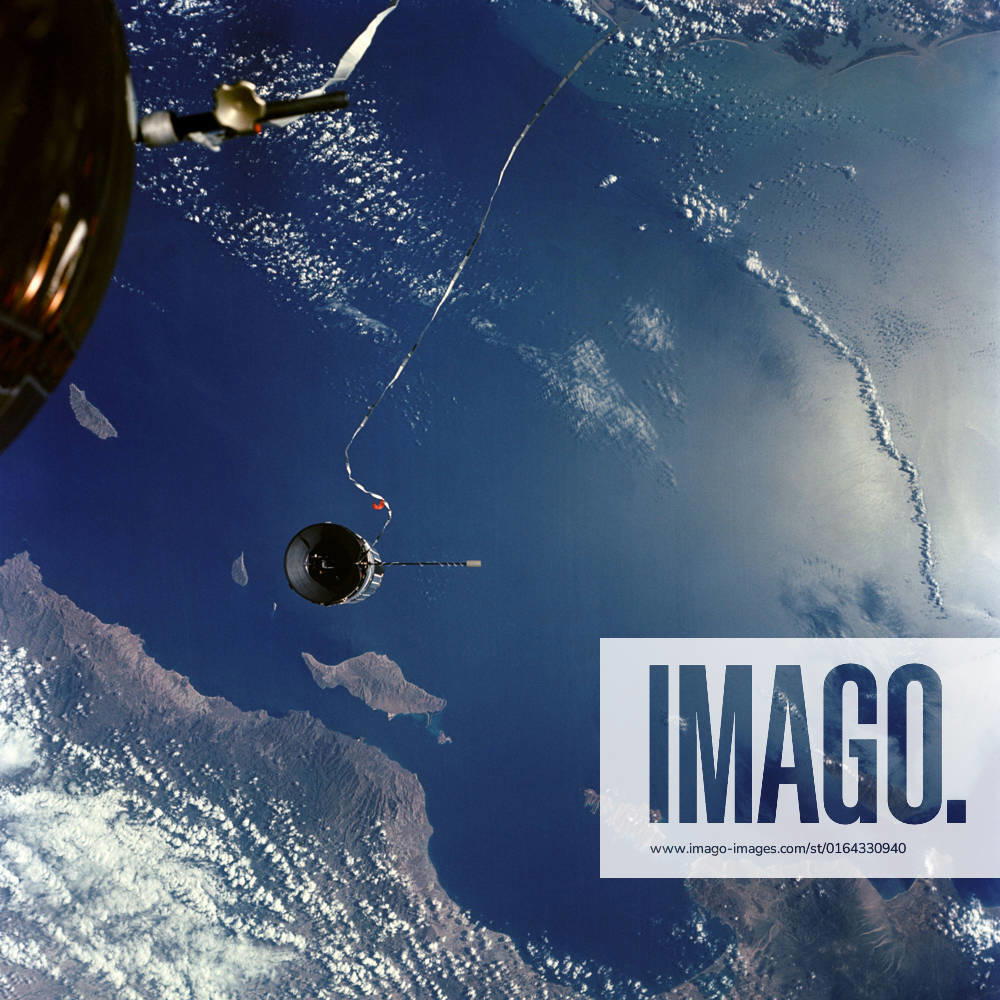 S66-54810 (14 Sept. 1966) --- The Agena Target Docking Vehicle is tethered to the Gemini-11 spacecraft during its 31st revolution of Earth. Area below is the Gulf of California and Baja California at La Paz. Taken with a J.A. Maurer 70mm camera, using Eastman Kodak, Ektachrome, MS (S.O. 368) color film.
