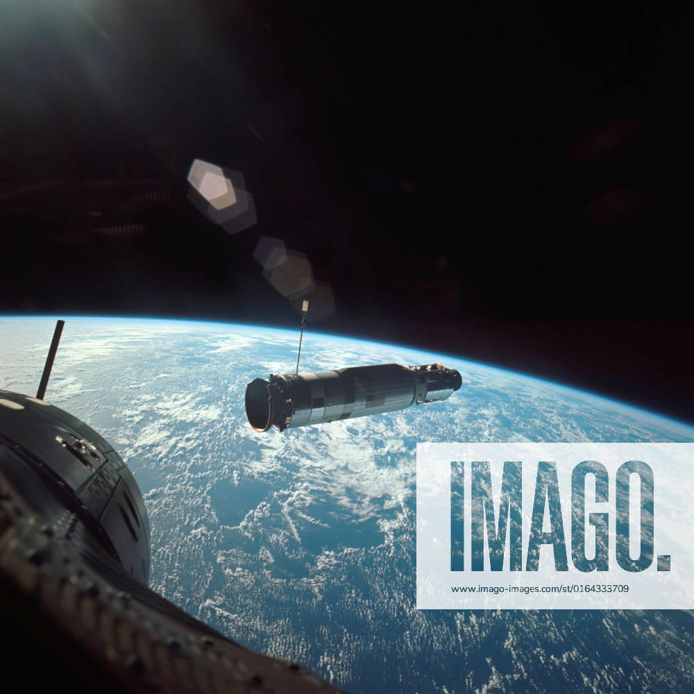 S66-46122 (18 July 1966) --- Agena Target Docking Vehicle 5005 is photographed from the Gemini-Titan 10 (GT-10) spacecraft during rendezvous in space. The two spacecraft are about 38 feet apart. After docking with the Agena, astronauts John W. Young, command pilot, and Michael Collins, pilot, fired the 16,000 pound thrust engine of Agena X s primary propulsion system to boost the combined vehicles into an orbit with an apogee of 413 nautical miles to set a new altitude record for manned spaceflight.