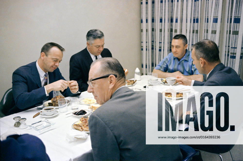 S65-21093 (23 March 1965) --- Astronaut Virgil I. Grissom (facing camera at right), command pilot of the Gemini-Titan 3 flight, is shown during a steak breakfast which he was served about two hours prior to the 9 24 a.m. (EST) GT-3 launch on March 23, 1965. Pictured in the foreground are Donald K. Slayton (right), assistant director for Flight Crew Operations; and Walter Burke, general manager of McDonnell Aircraft Corporation Spacecraft and Missiles. Pictured in the background are astronaut Alan B. Shepard Jr. (left) and Walter C. Williams, former deputy director of the Manned Spacecraft Center, now with a private aerospace firm.