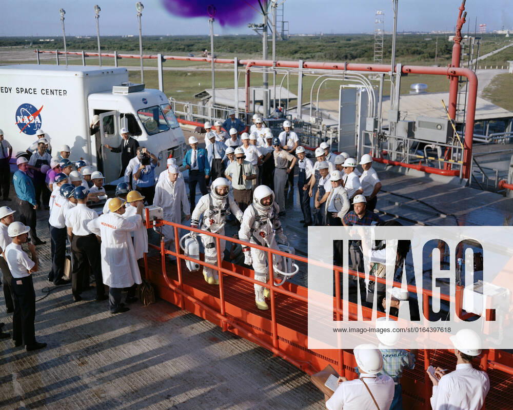 S65-28737 (21 Aug. 1965) --- Astronauts L. Gordon Cooper Jr. (foreground) and Charles Conrad Jr. walk up gantry ramp after arriving at Pad 19 during Gemini-5 countdown at Cape Kennedy, Florida.