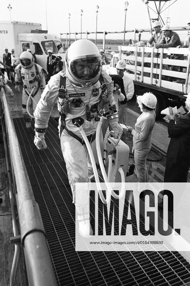 S65-61916 (12 Dec. 1965) --- Astronauts Walter M. Schirra Jr. (foreground), command pilot; and Thomas P. Stafford, pilot, arrive at Pad 19 during the Gemini-6 prelaunch countdown. NASA has planned Gemini-6 as a two-day mission in space. An attempt was made to launch Gemini-6 at 9 54 a.m. (EST) on Dec. 12, 1965. However, seconds after ignition, the first stage engine of the Gemini-6 launch vehicle shutdown due to a faulty release of a liftoff umbilical plug.