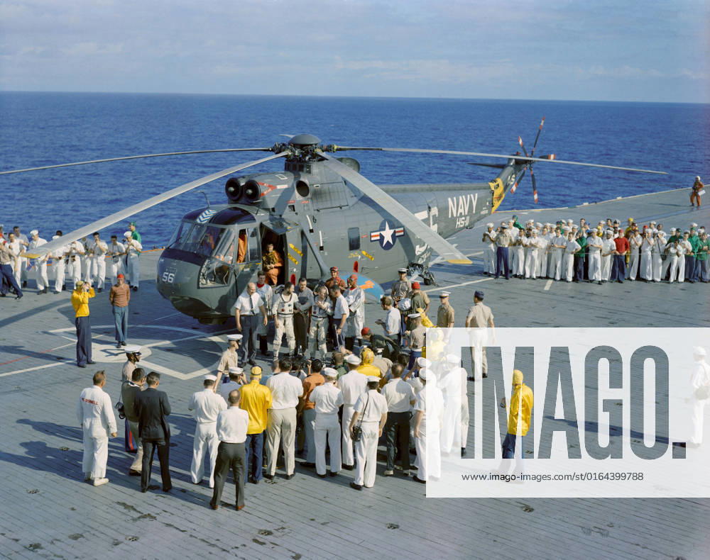 S65-63646 (18 Dec. 1965) --- The crew of the Gemini-7 spaceflight, astronauts Frank Borman, command pilot, and James A. Lovell Jr., pilot, arrive aboard the aircraft carrier USS Wasp. The astronauts were picked up from the ocean, following successful splashdown, by recovery helicopter and flown to the carrier to begin postflight medical and technical debriefings.