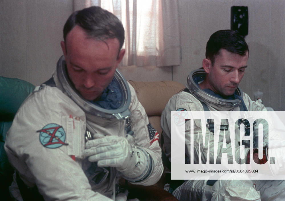 S66-42424 (18 July 1966) --- Astronauts John W. Young (right), command pilot, and Michael Collins (left), pilot, prime crew for the Gemini-10 spaceflight, undergo suiting up operations in the Launch Complex 16 suiting trailer.
