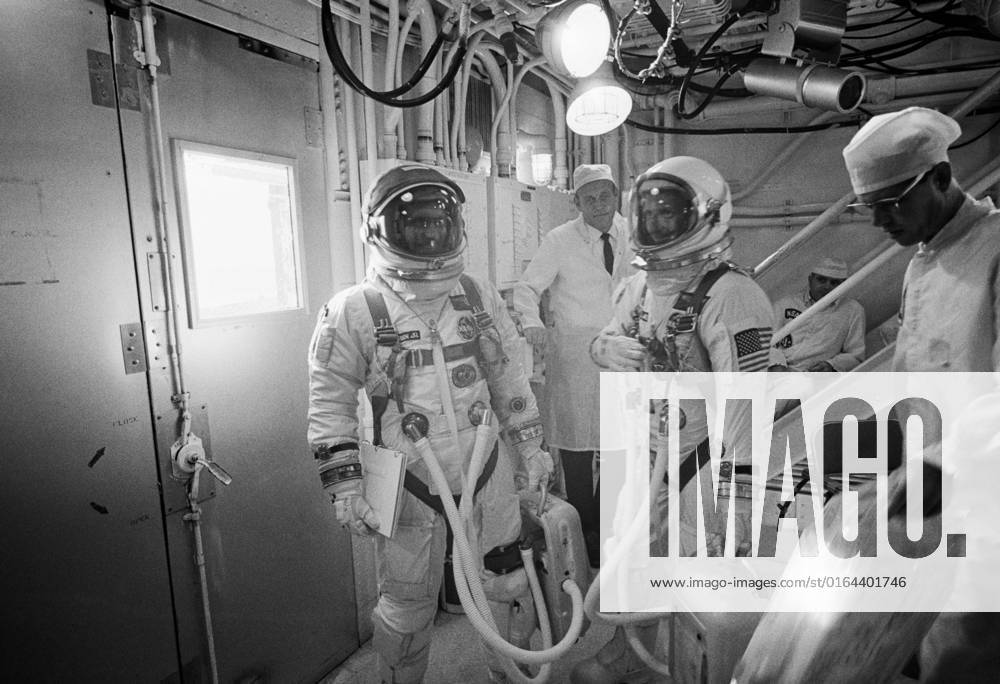 S66-57967 (10 Sept. 1966) --- Gemini-11 prime crew, astronauts Charles Conrad Jr. (right), command pilot, and Richard F. Gordon Jr. (left), pilot, prepare to enter the Gemini-11 spacecraft in the White Room atop Pad 19.