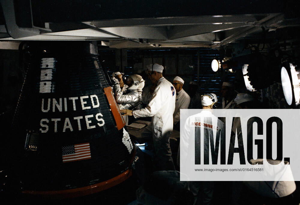 S63-09676-E (15 May 1963) --- Astronaut L. Gordon Cooper Jr., pilot of the Mercury-Atlas 9 (MA-9) Earth-orbital space mission, is assisted into his Faith 7 Mercury spacecraft during the prelaunch countdown. MA-9 was launched on May 15, 1963, and the flight lasted for 34 hours and 20 minutes.