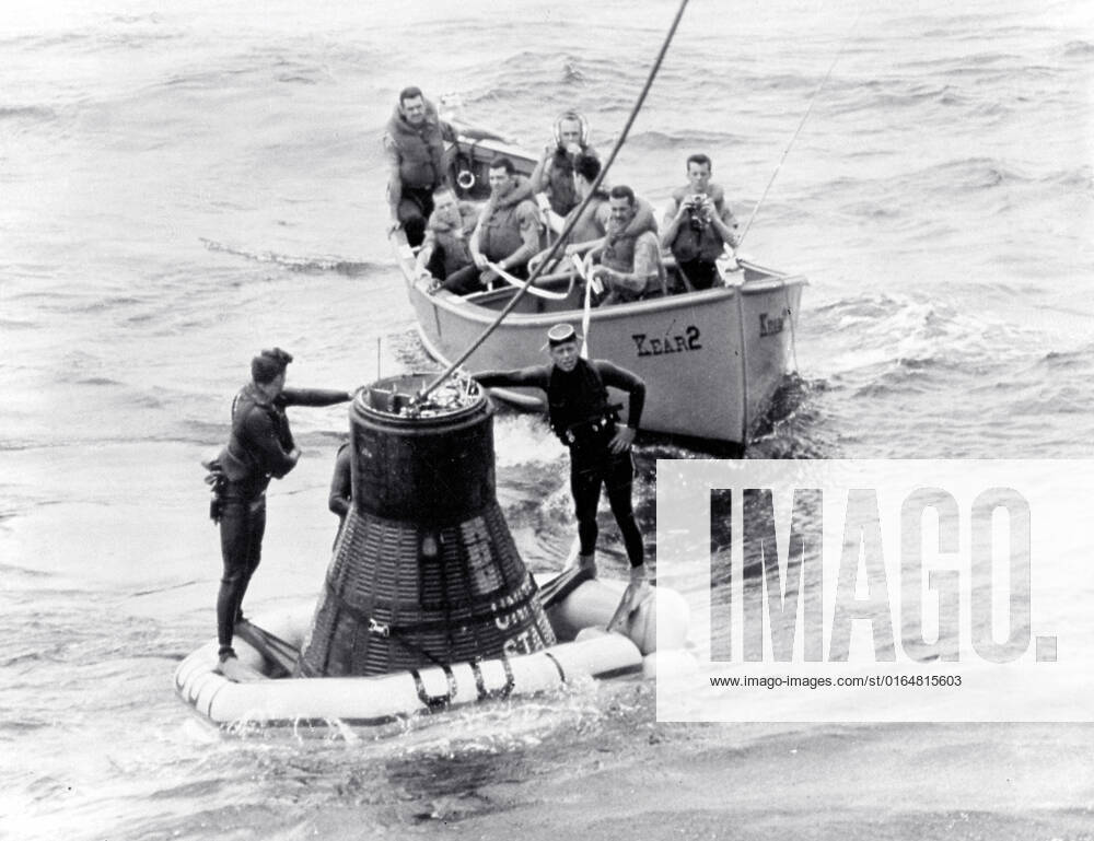 The recovery operation of the Faith 7 spacecraft after the completion of the 1-1 2 day orbital flight (MA-9 mission) with Astronaut Gordon Cooper. Navy frogmen attach the flotation collar to the spacecraft. The MA-9 mission was the last flight of the Mercury Project and launched on May 15, 1963 boosted by The Mercury-Atlas launch vehicle.