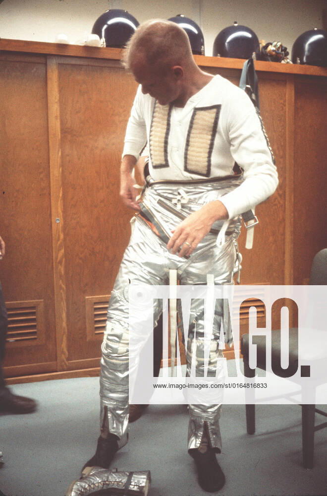 S64-14848 (20 Feb. 1962) --- Astronaut John H. Glenn Jr. dons spacesuit during preflight operations at Cape Canaveral, Feb. 20, 1962, the day he flew his Mercury-Atlas 6 spacecraft, Friendship 7, into orbital flight around Earth.