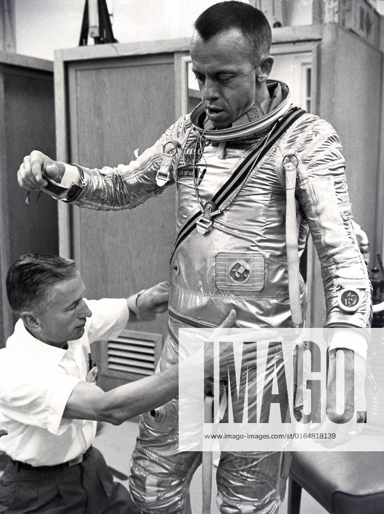 Astronaut Alan Shepard fitted with space suit prior to the first marned suborbital flight. Freedom 7, carrying Astronaut Alan Shepard, boosted by the Mercury-Redstone launch vehicle, lifted off on May 5, 1961. Astronaut Shepard became the first American in space.