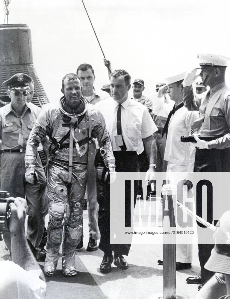 Astronaut Gordon Cooper leaves the Faith 7 (MA-9) spacecraft after a successful recovery operation. The MA-9 mission, the last flight of the Mercury Project, was launched on May 15, 1963, orbited the Earth 22 times, and lasted for 1-1 2 days.