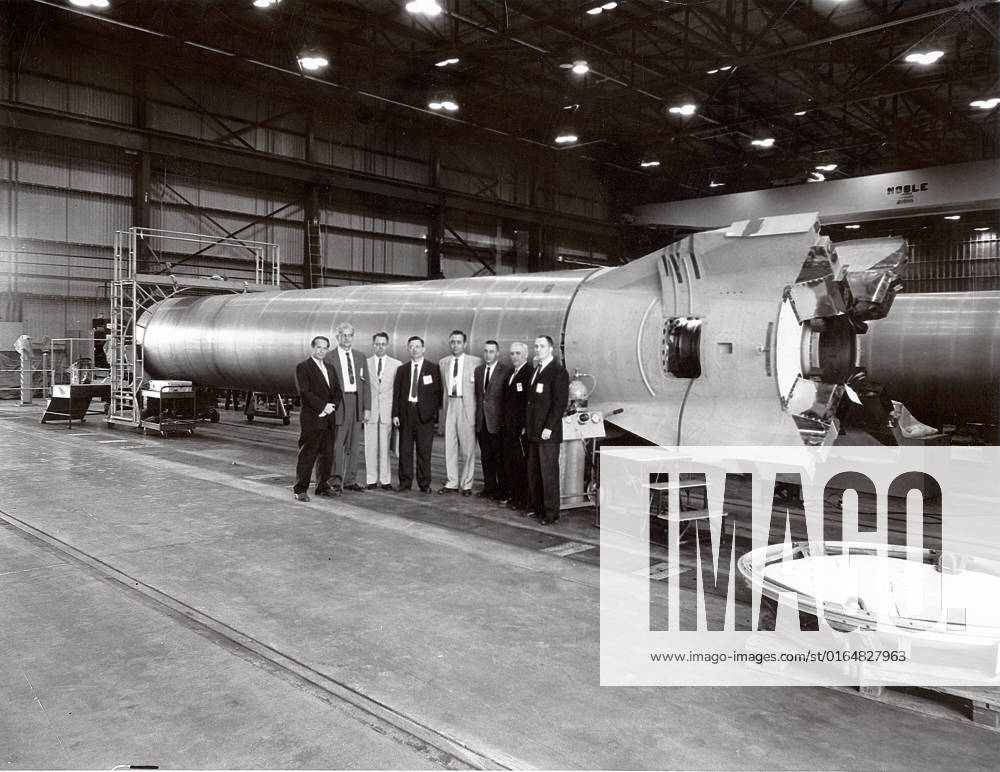 This photograph shows a group of officials standing before a Mercury-Redstone booster at the Marshall Space Flight Center (MSFC). Among those in the photograph are astronauts James Lovell, Walter Schirra, and Gus Grissom. Also pictured is Joachim Kuettner who managed responsibilities of MSFC s Mercury-Redstone program.