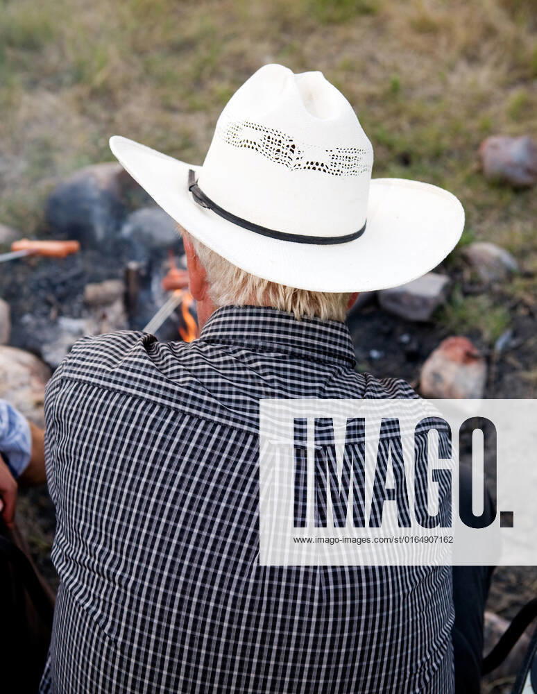 A cowboy viewed from the back