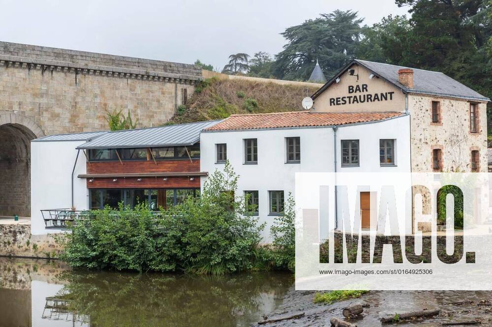 Architectural detail of the restaurant Le Moulin in Rocheserviere, Rocheserviere, Pays de la Loire, France - September 21, 2020: architectural detail of the restaurant Le Moulin, by the La Boulogne river on an autumn day, Rocheserviere, Pays de la Loire, France - September 21, 2020: architectural detail of the restaurant Le Moulin, by the La Boulogne river on an autumn day, 22.09.2020,